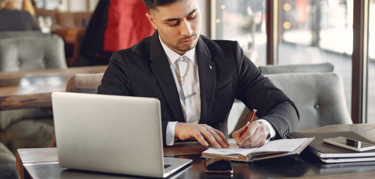Bookkeeping for small business in Dubai concept with financial documents and calculator