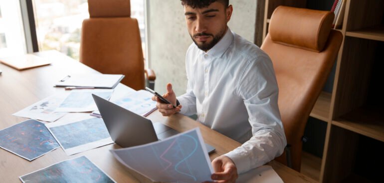 Business owner reviewing VAT compliance documents in Dubai office